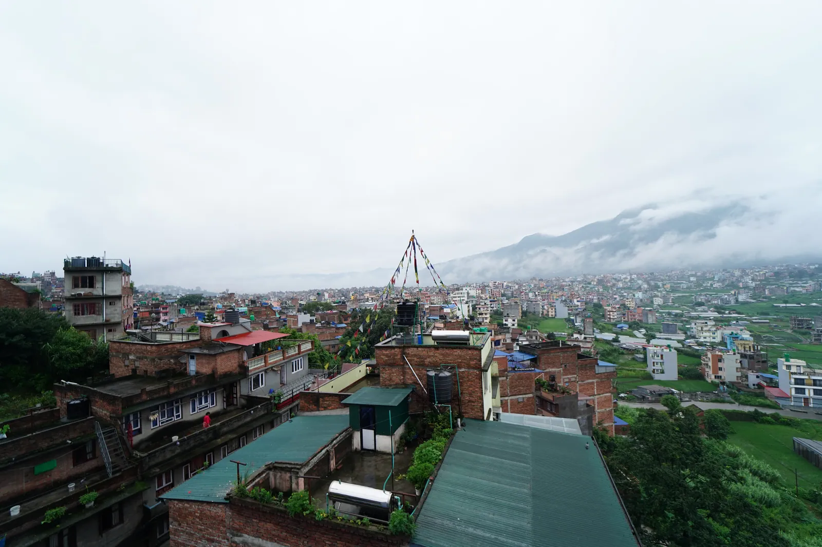 Green terraces toward the Chandragiri ridge