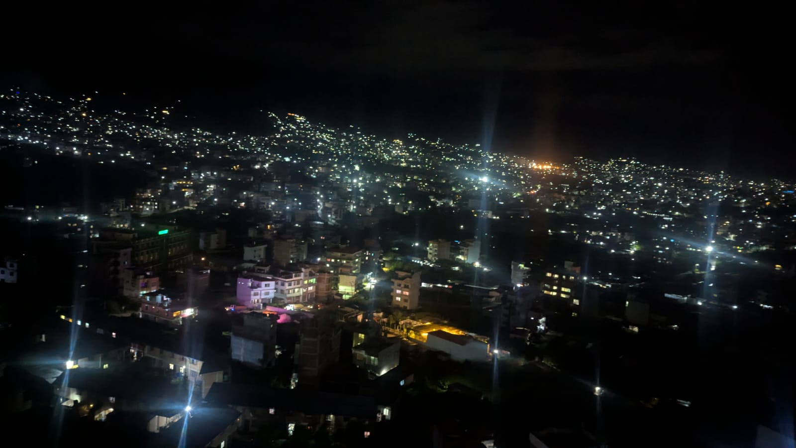 The warm lantern glow from the Jhigu Casa units, illuminating the night with a peaceful ambiance.